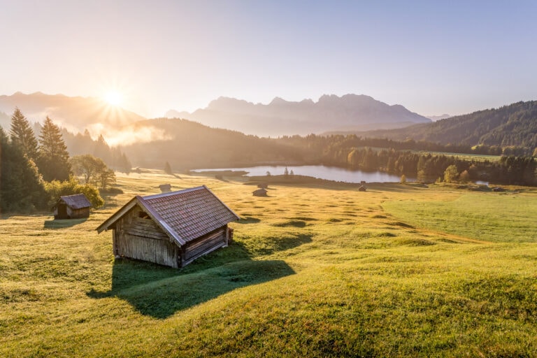 View Over Geroldsee With Wooden Hut And Karwendel Mountains At Morning, Bavaria, Germany